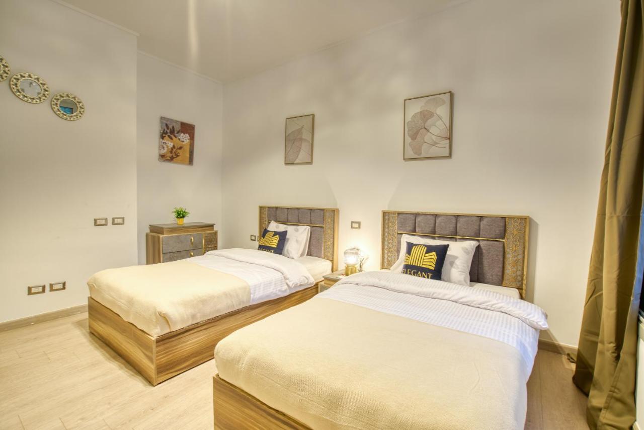 The Suites Near Auc By Elegant Cairo Exterior photo